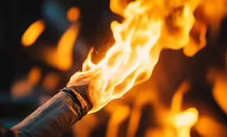a close up image of a hot stick with yellow flames