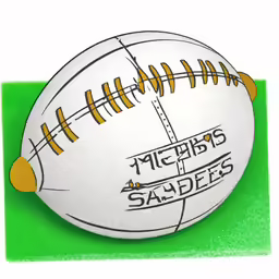 a football sitting on top of a green area