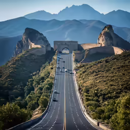 the highway is empty and surrounded by mountains