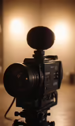 a video camera with some lights behind it
