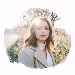 a woman standing outside in the sun