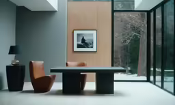 two chairs sitting in front of a table