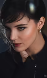 beautiful woman in black with red lipstick and hoop earrings