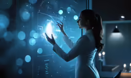 woman looking at computer screen while pointing at it