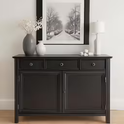 a cabinet is in front of a painting