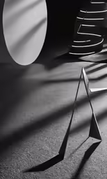 a very long shadow on the ground and some interesting shapes