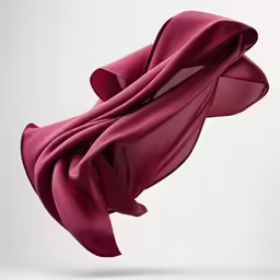 a large maroon red scarf hanging in the air