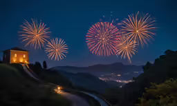 fireworks are lit up above the town at night