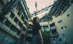 a young girl is walking along the alleyway
