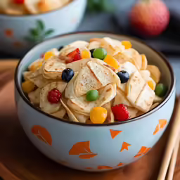 there is a bowl of fruit salad with rice