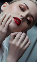 a woman posing with her hands over her face