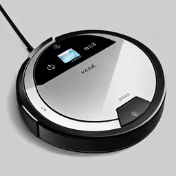 a black and white robot that is on a floor