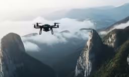 a helicopter flying over a large mountain with lots of cloud