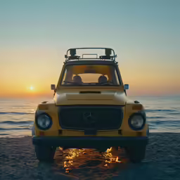 a yellow jeep is on the beach with the sun in the background