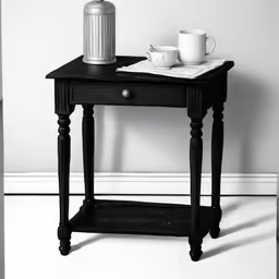 a black and white photo of a table with a white vase