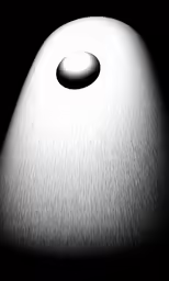 a white table with a large white lamp and a circular object