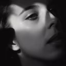 woman with dark makeup with white background