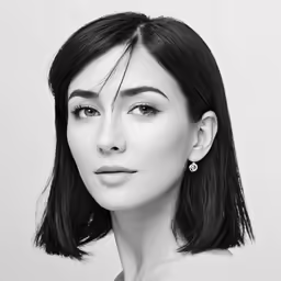 a woman with dark hair and blue eyes