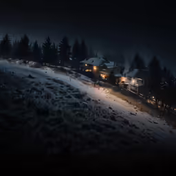 some houses are on the hill in the night