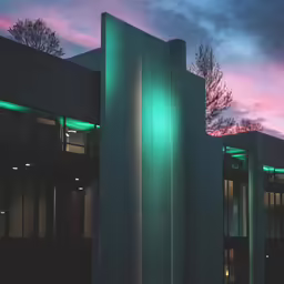 a large building with lights on the outside of it