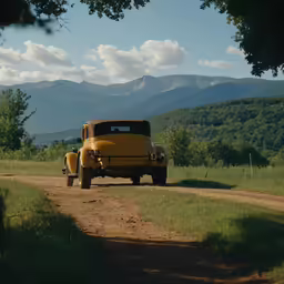 an old car sitting on a road that is going down the side