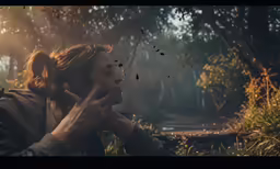 there is a man in a jacket standing in the woods