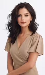 a woman wearing a dress posing for the camera