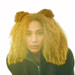 a woman is posing with a big curly afro