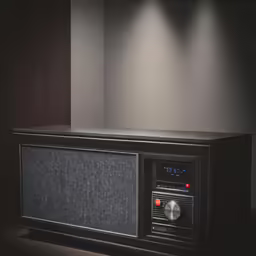 an old radio sitting on top of a wooden shelf