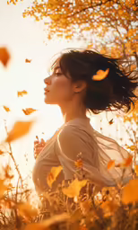 woman in a field of flowers holding onto her hair