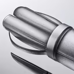 two metal razors sitting next to each other