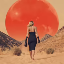 a woman is walking on a dirt road in front of an orange and pink backdrop