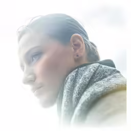 a person with a winter coat is staring away