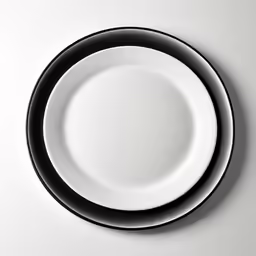a close up of an empty plate with black rim