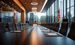 conference room set up in front of large window with lights