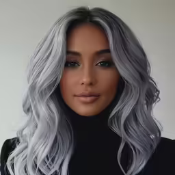 the beautiful woman with light hair is wearing black and white