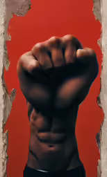 the back end of a shirtless male with his fist up