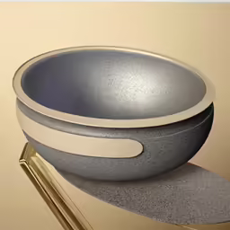 a bowl that is sitting on top of a gold table