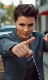 a woman pointing at something while sitting on a bench