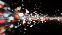 a rain filled glass window at night that is reflecting the city lights