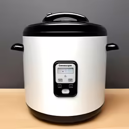 a white and black pressure cooker sitting on a counter