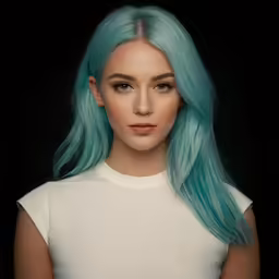 a blonde and blue hair girl is looking off to the side
