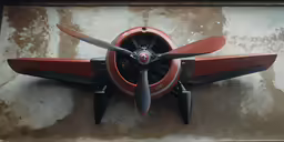 a small airplane with large blades mounted on the side of the wing