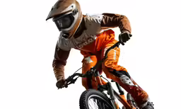 the helmeted man is doing stunts on his bike