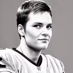 a black and white photo of a women in a football uniform