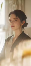 the woman is looking off into the distance