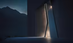 the door of an entrance is lit up in the dark