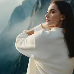 a woman in white is looking away from the camera