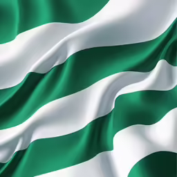 the green white and grey stripe of the irish flag is blowing in the wind