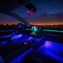the interior of a car with a picture on its screen